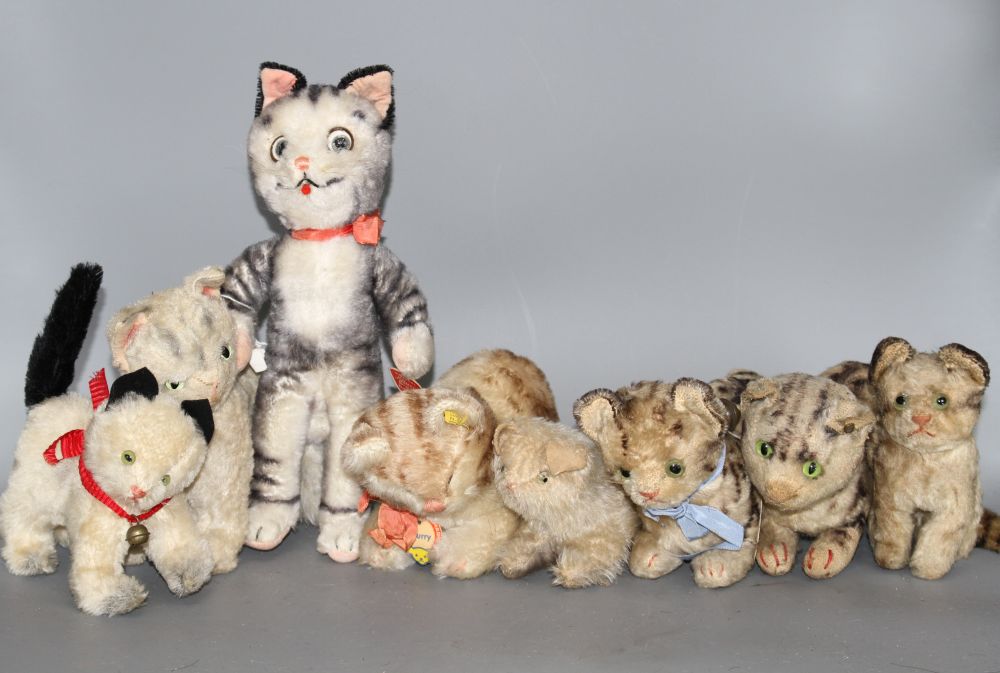 A group of assorted vintage soft toy cats including Steiff